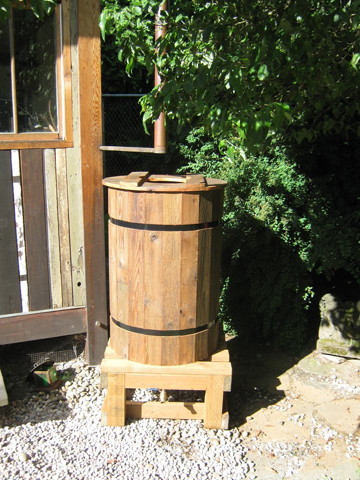 Drum with single Rainsaucer on cinder blocks
